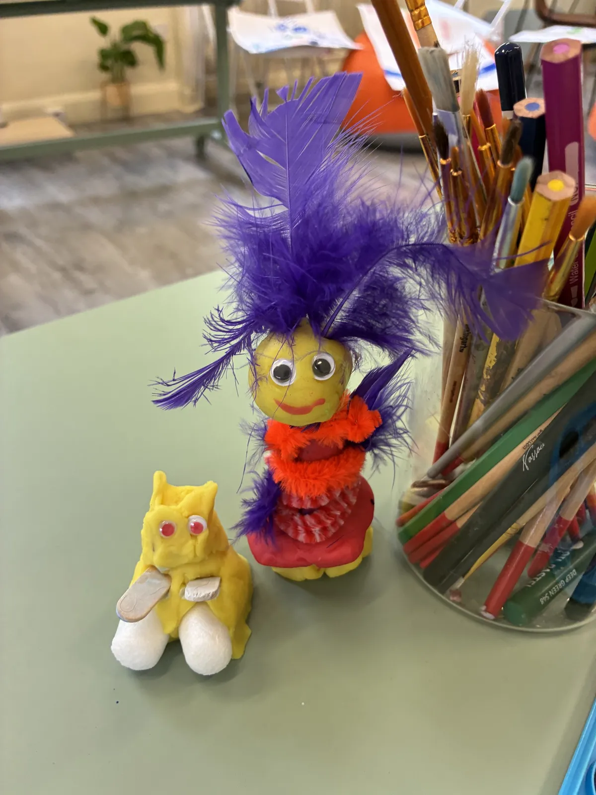 A feather doll made at a children’s workshop