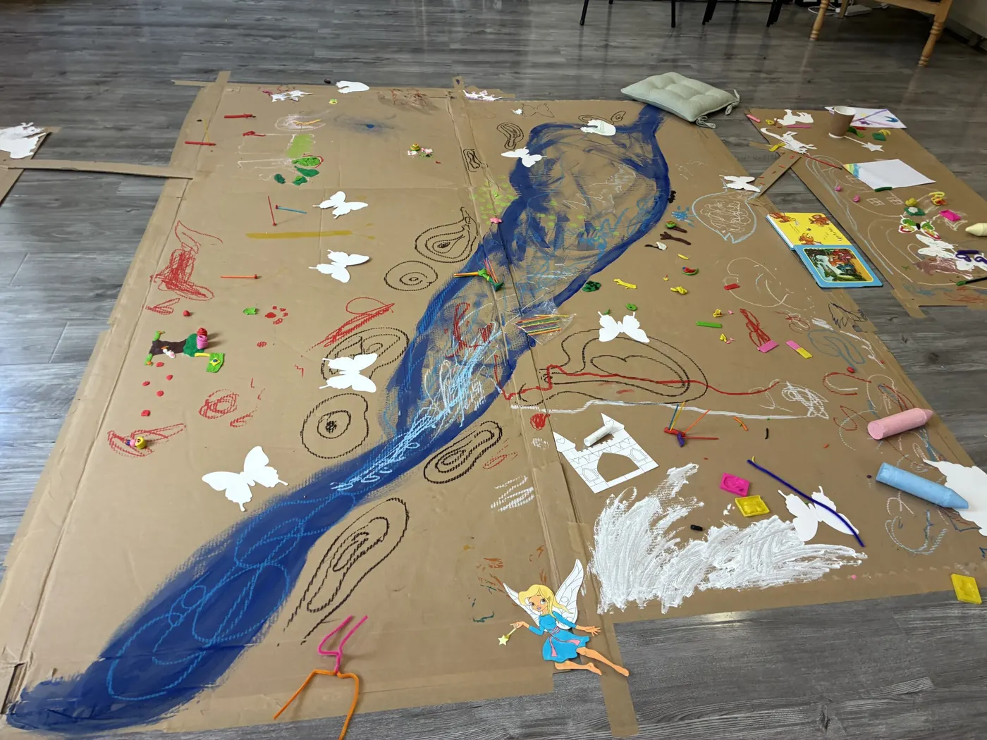 The river Robe painted on paper across the floor by children