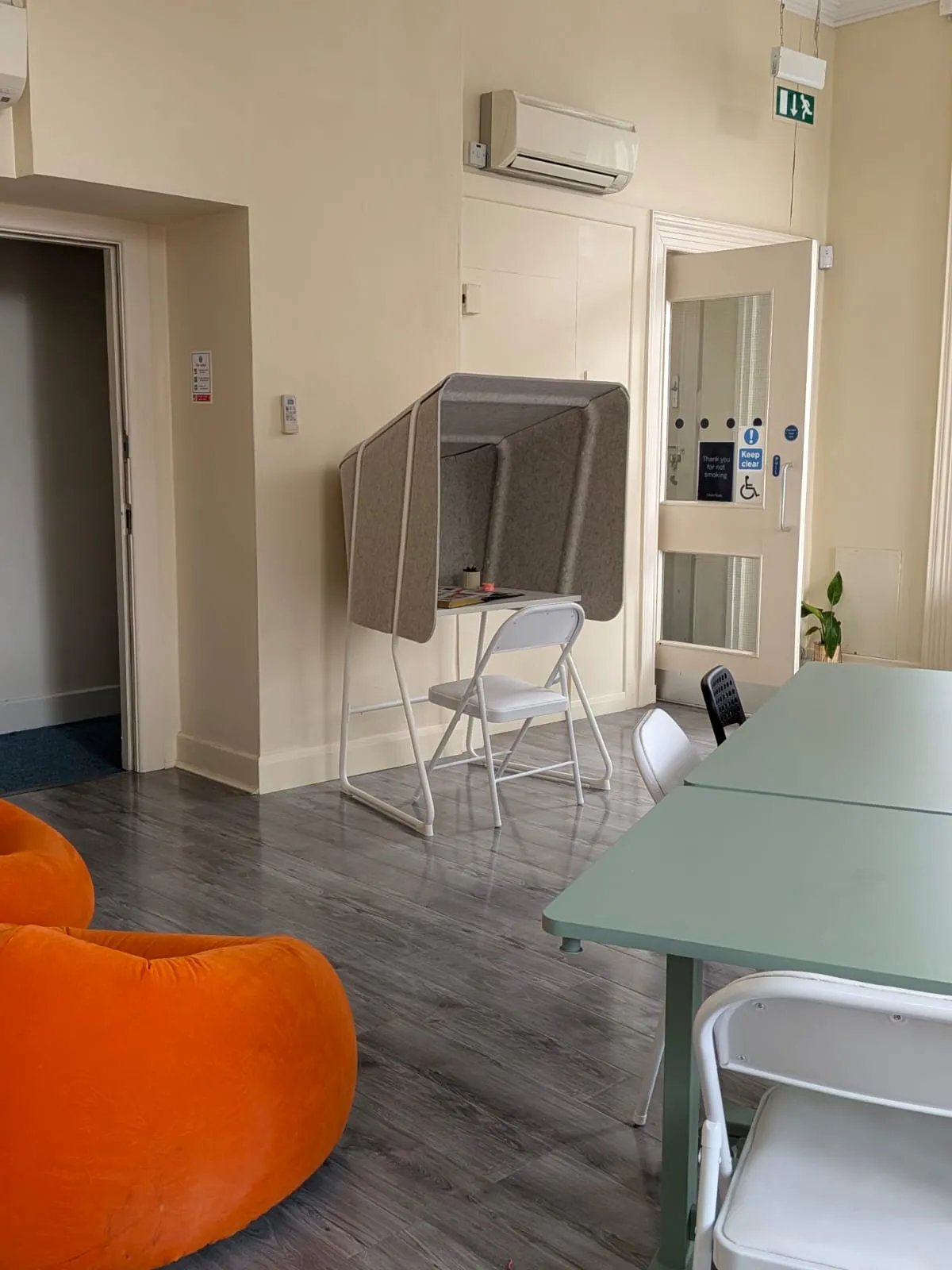 Beanbags and a phone booth in the hot-desk area